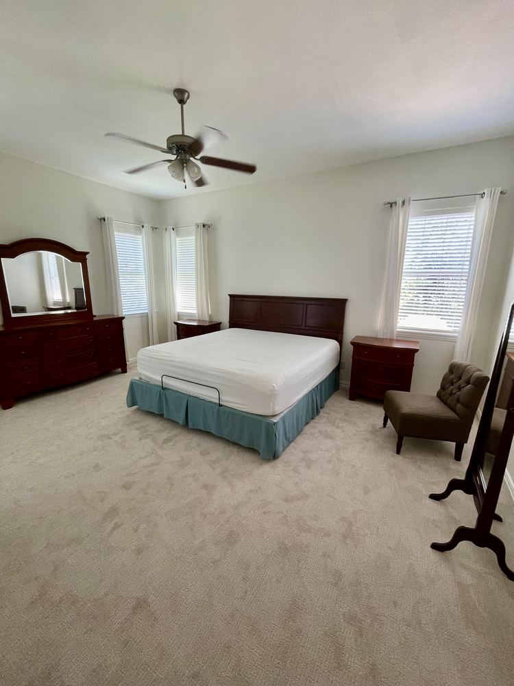 Primary bedroom before staging
